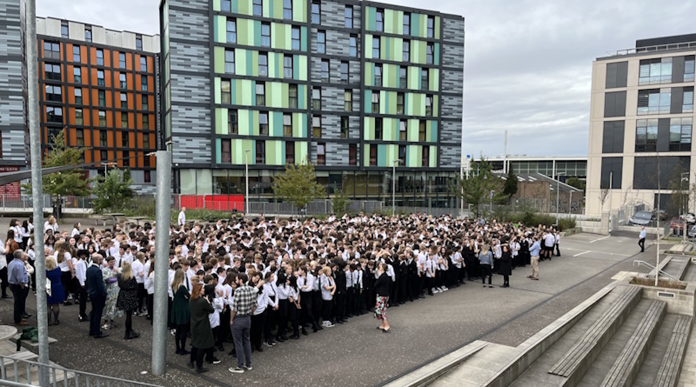Boroughmuir staff and pupils being photographed in the playground
