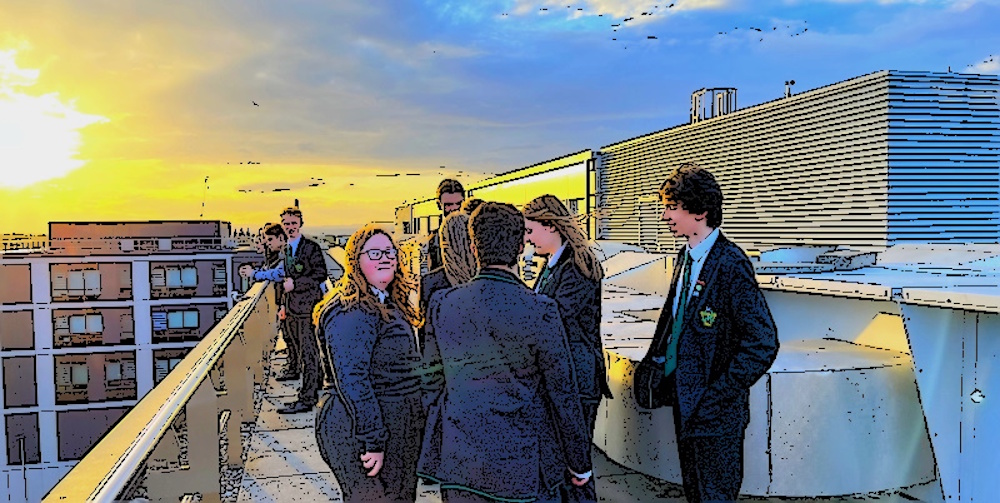 Sixth year pupils on the roof at Boroughmuir at sunset